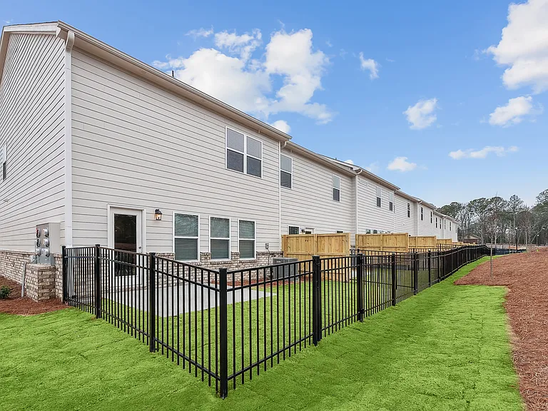 Back patio with fenced in yard.