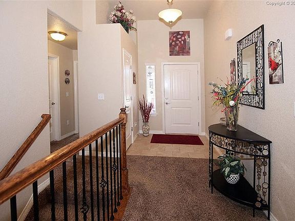 Vaulted Ceilings, Tile Entry, Wrought Iron Spindels