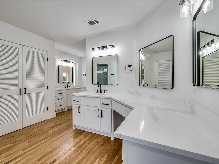 Separate vanities and sinks at primary bath area