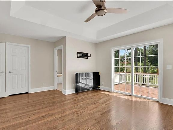 Master bedroom with a private deck ,shower and Jacuzzi and full walking closet in the main floor