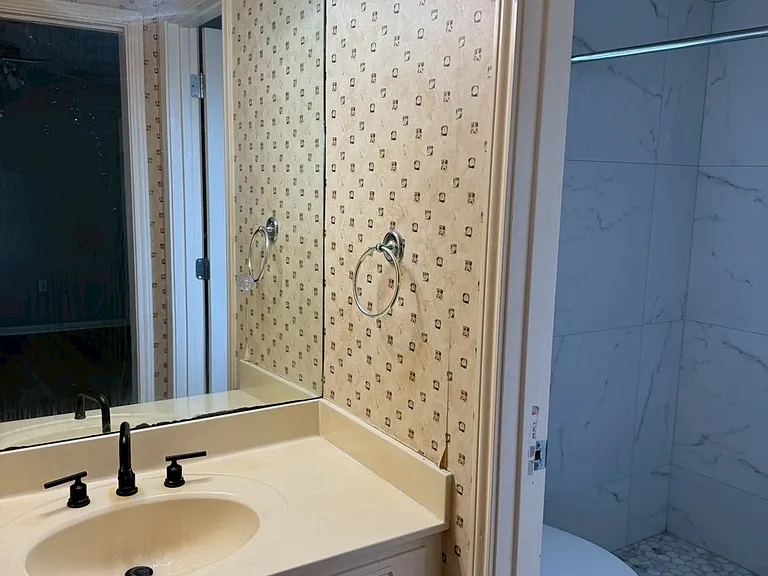 __ Primary Bathroom
"Beautifully remodeled bathroom featuring a walk-in tile shower, modern fixtures, and fresh finishes."