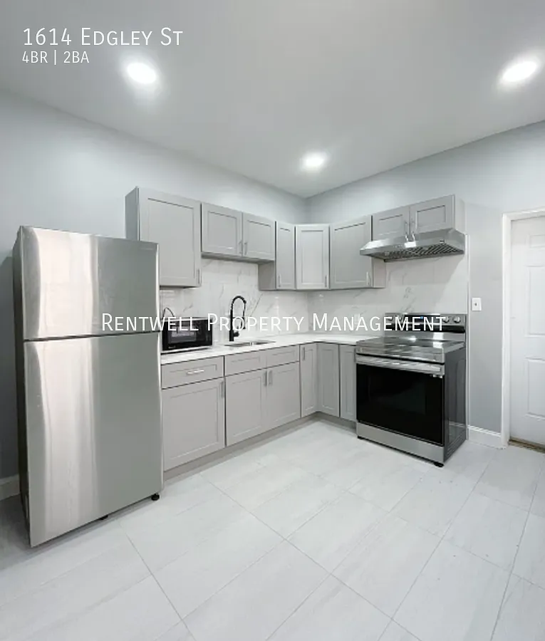 Spacious 4 Bedroom Townhome with Private Patio & In-Unit Laundry — Photo 1