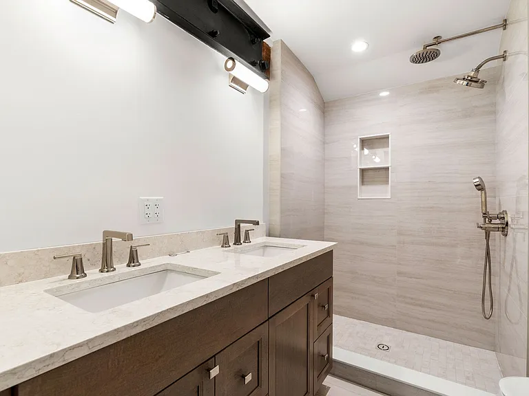 Master Bath with double sinks. Three shower heads, Imported tile.