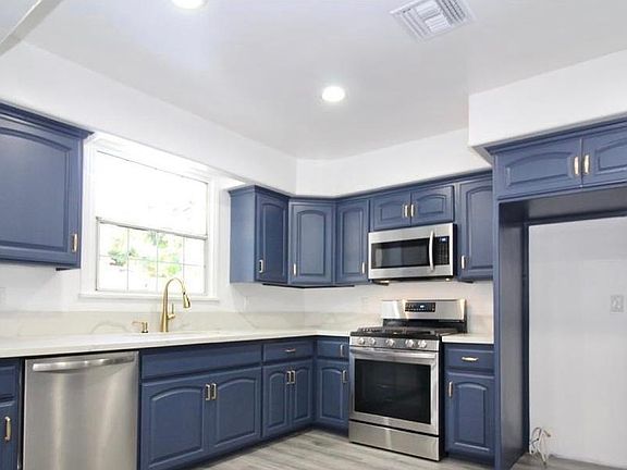 Kitchen, stainless steel refrigerator also included (not pictured here)