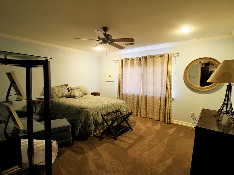 One of three upstairs bedrooms. This has an attached bathroom