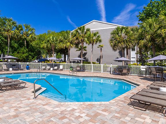 Our resort-style pool features shaded seating, modern loungers, and a beautifully landscaped sundeck that's perfect for relaxing or entertaining.