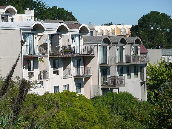 View of backside of building facing East. 4 private decks.