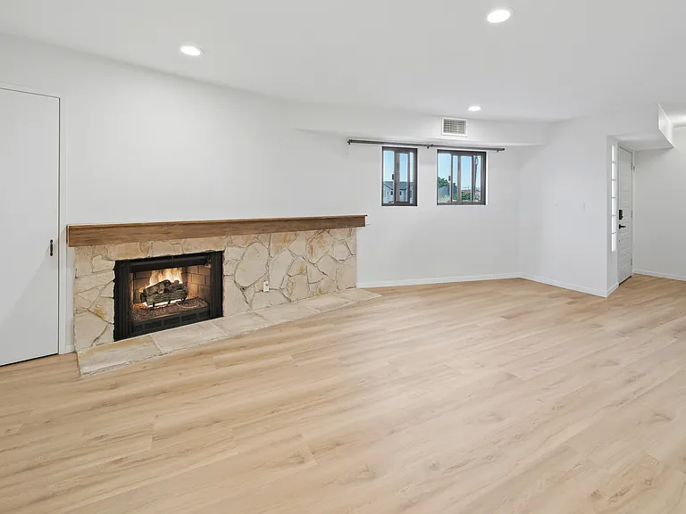 Living room has a real fireplace