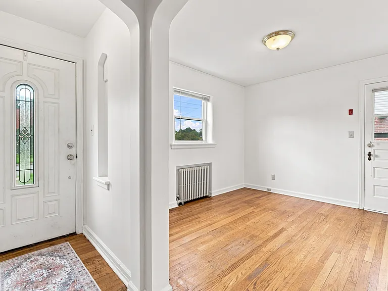 foyer and dining room with another exit to the garage on the side