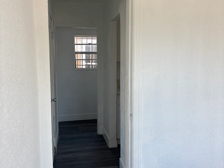 HALLWAY TO BEDROOM, BATHROOM, KITCHEN, LAUNDRY