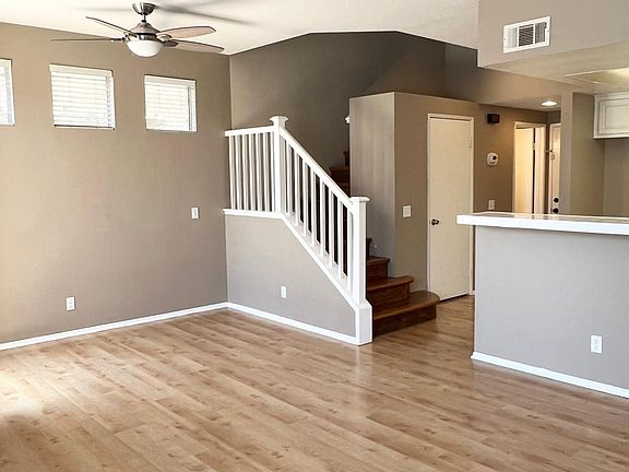 Dining room area with ceiling fan/light combo and open concept