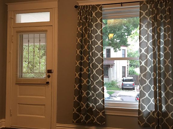 inside front door with new drapes and up/down blinds