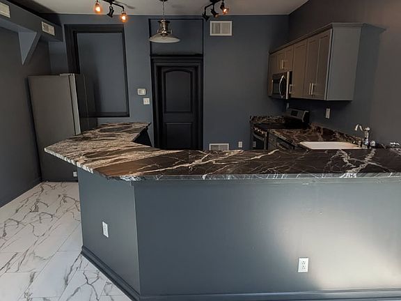 Kitchen/Bar with Granite Bar Top.