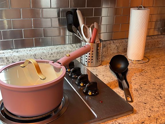 Kitchen with cook top and all the essentials you'd need for daily cooking.