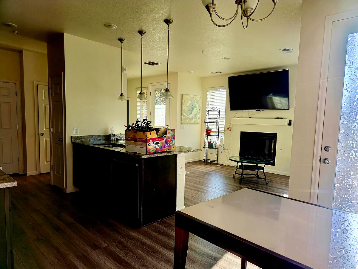 Bonus Wall mounted TV above fireplace that can easily be lowered and adjusted to meet your viewing comfort. - 23648 E Ida Dr #A