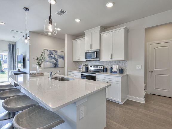 Prep dinner in the kitchen without missing the conversation in the great room.