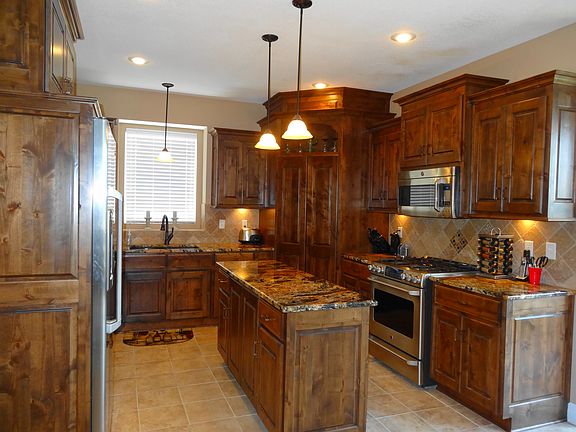 4th image of 20900 E 50th Terrace Dr S