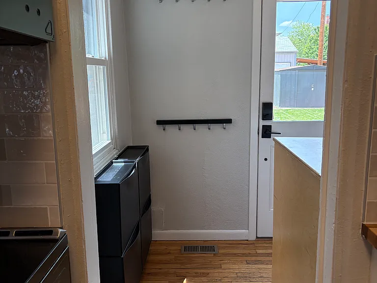 from kitchen looking into laundry/back entrance through back door.