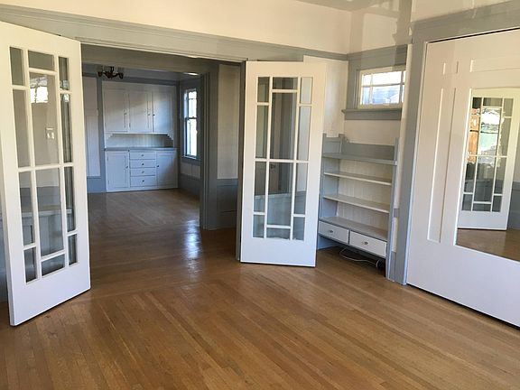 Craftsman-style details, looking from front room towards living room with built-in cabinets