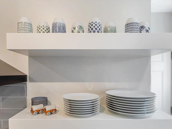 Open shelving with fully-stocked kitchen