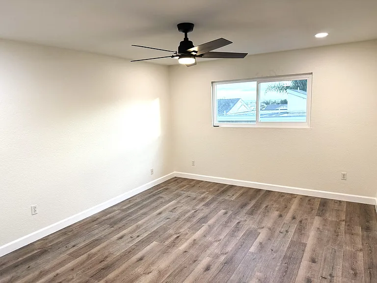 Bedroom 2 which is 12.5 ft wide and 15.5 ft long (same size as downstairs primary bedroom)
