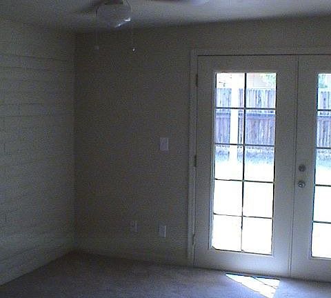 Master bedroom with french doors leading to large back yard