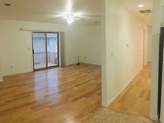 HALLWAY TO THE BATHROOMS AND BEDROOMS