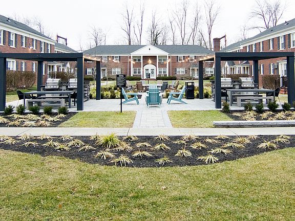 Dine al fresco with outdoor grilling and shaded seating