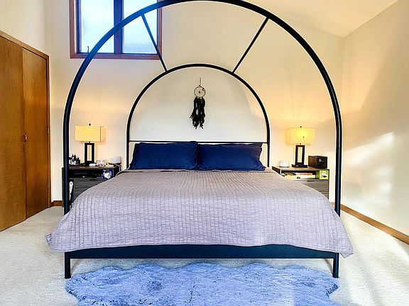 Master bed (doors to walk in)