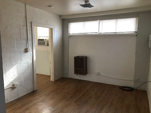 First room upon entering the apartment. Previous tenants have use this as a living room and/or dinning room but this is combined with the Kitchen