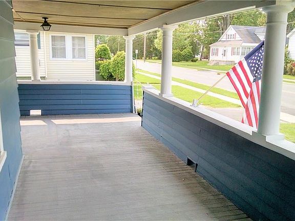This veranda is ready for you to put out your porch furniture and enjoy the serenity of summer!