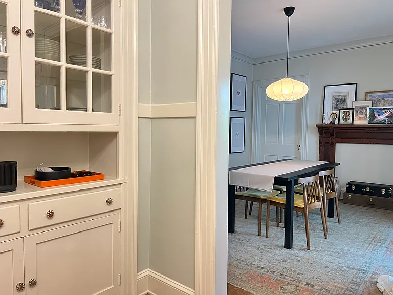 Original butler pantry in the kitchen leading to dining room