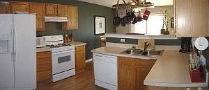 Plenty of Counter Space in this Oak Kitchen with Pantry.
