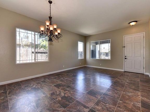 The gorgeous laminate floors and neutral color pallet make a lovely first impression as you walk into the home.