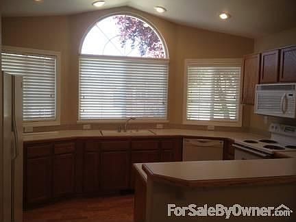 Open kitchen with breakfast counter
						:
						Lots of storage, DW, electric stove (gas avail in house) and pantry