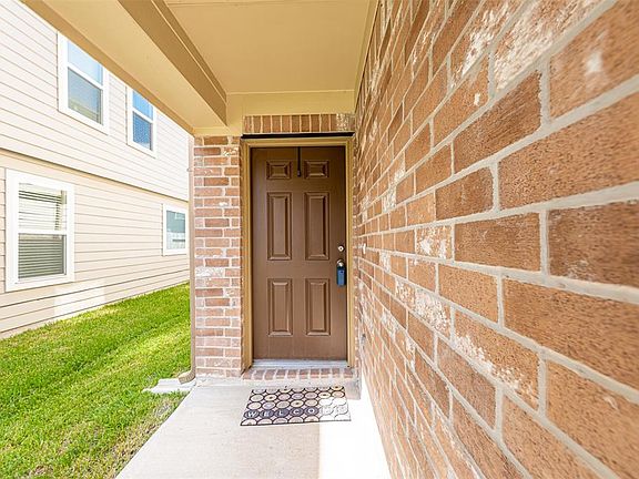 Welcome home! Charming landscaping lead you to the covered front porch and a beautiful front door.