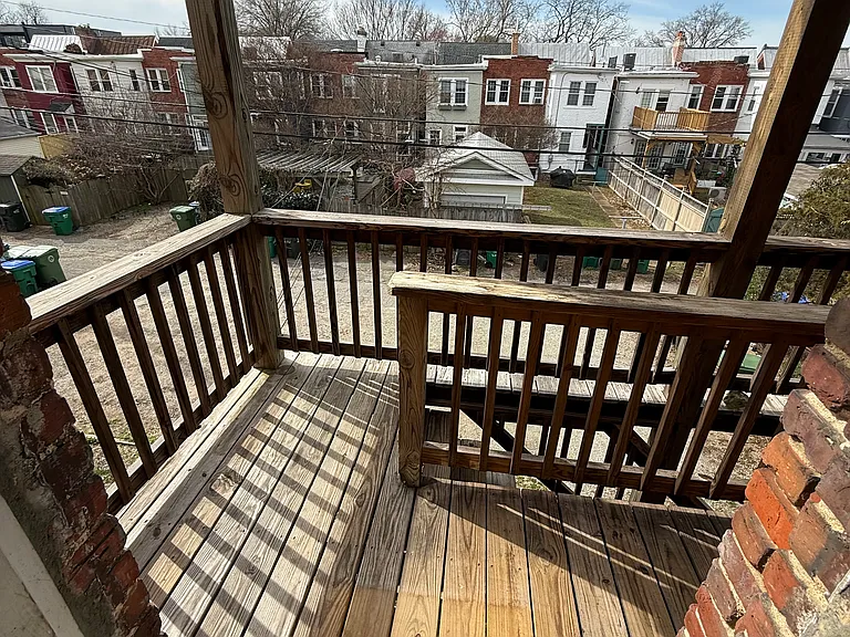 Back porch with stairs to off street parking off the alley