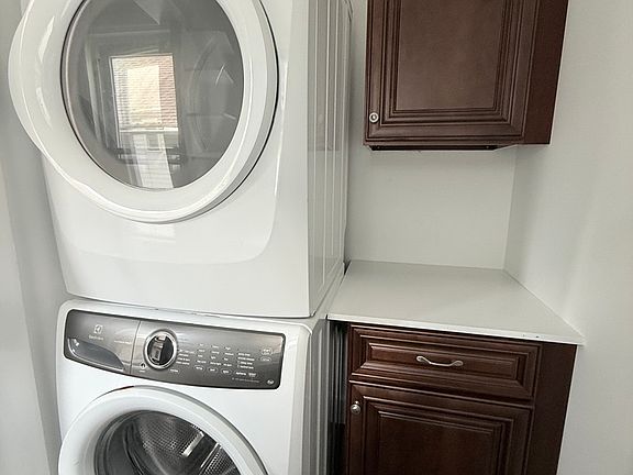 Laundry room with storage space