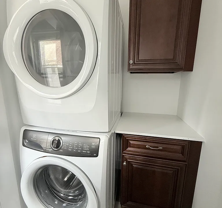Laundry room with storage space