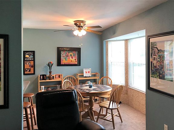 Breakfast area with bay window that is updated with ceramic stone tile.  The seller is willing to negotiate all furniture in thi