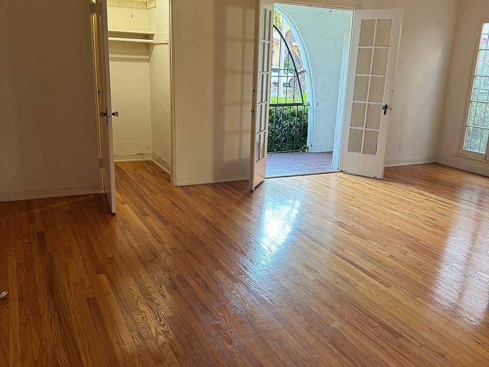 Living room, walk in storage closet and private patio can be seen in this picture. 9.5 feet high ceilings and closet with desk exist as well