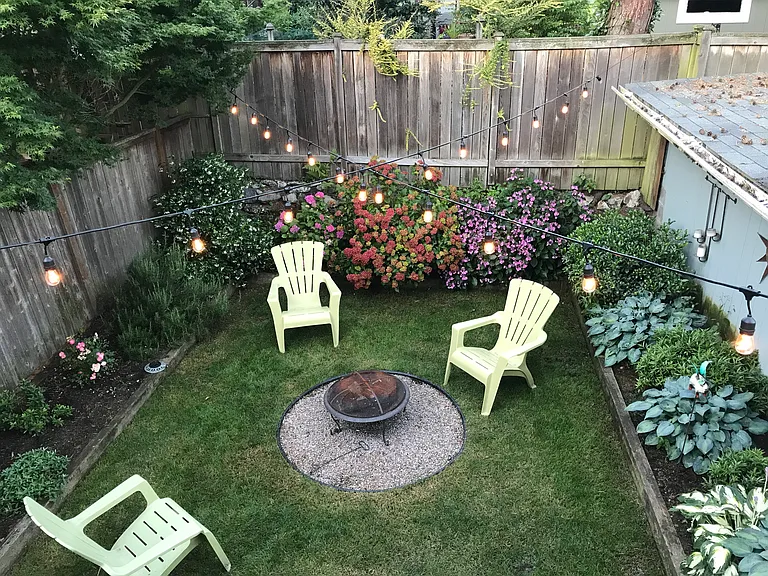 Backyard with fire pit - view from deck above off kitchen where the grill is located