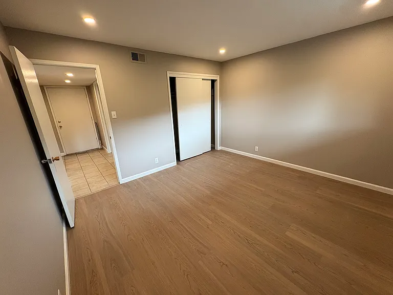 Bedroom , fresh paint, New Laminate flooring, new baseboards through out Apt.