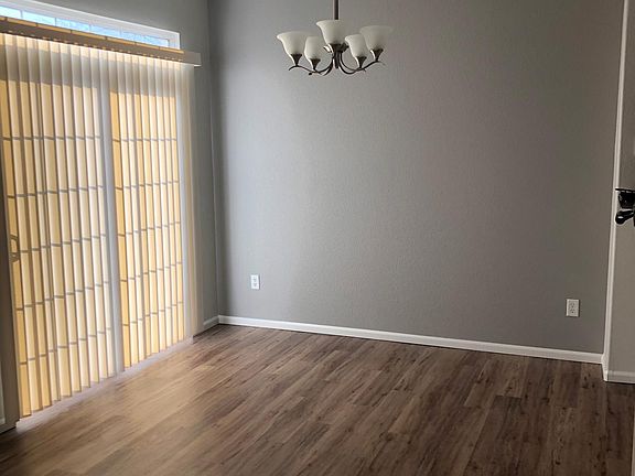 Dining room area, sliding glass door leads to patio.