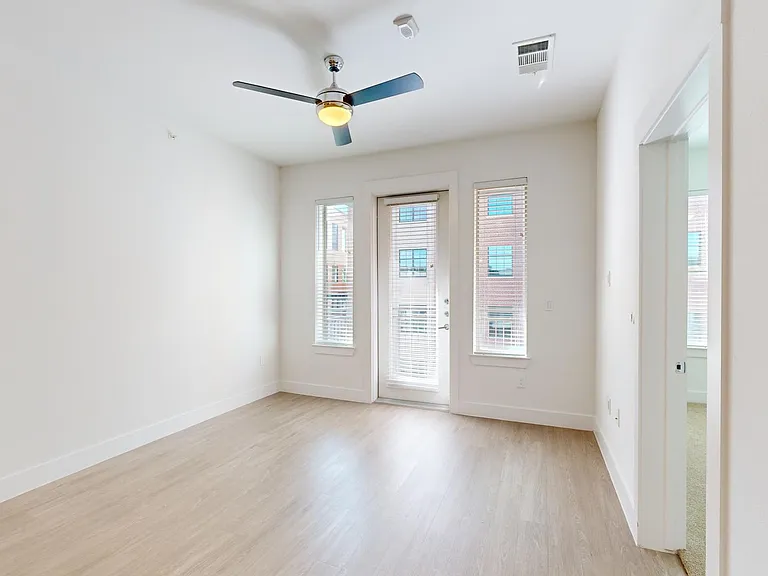 Apartment living room with wood-style flooring.