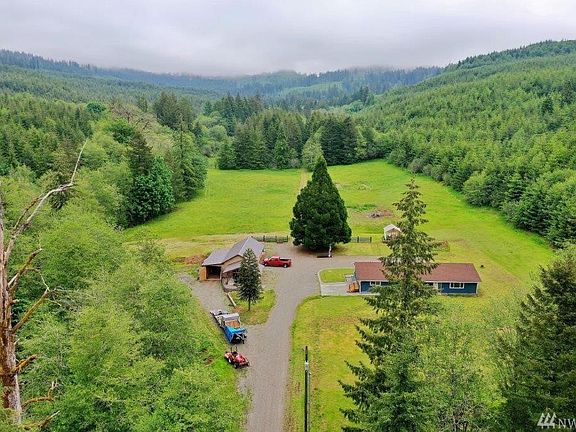 Creek follows the tree line on left. Shop/garage and 2,520 sf one level home. 