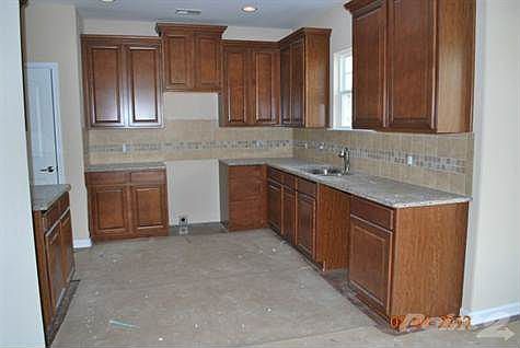 Kitchen with granite tops and wood laminate Flrs
