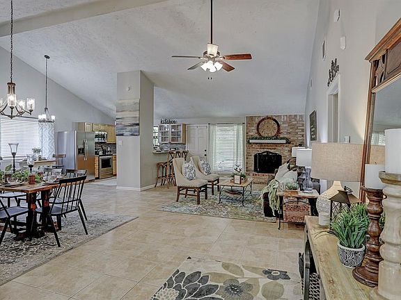 Large open-concept Living Room with wood burning fireplace