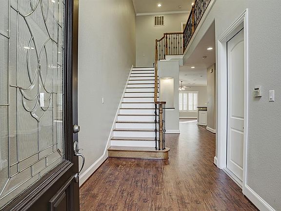 Grand Entry tall ceilings new floors & new paint. Beautiful staircase.
