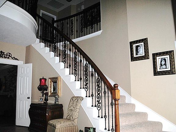 From the moment you step into the foyer and view the elegance of the sweeping staircase, you will be